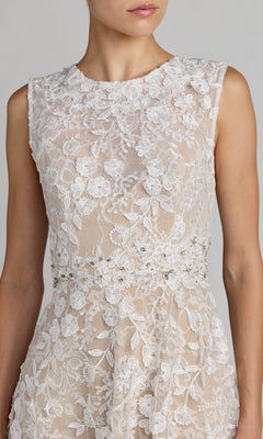 A woman wearing the Mac Duggal 69192 Tea-Length Party Dress, featuring a sleeveless fitted bodice with floral lace and beaded embellishments, and a beautifully tailored waist, shown from shoulders to hips.