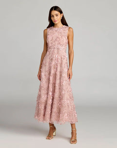 Wearing the Mac Duggal 69192 Tea-Length Party Dress in rose, this woman stands in heels against a plain background. The dress features a sleeveless, fitted bodice and an elegant A-line skirt with light pink floral lace detailing.