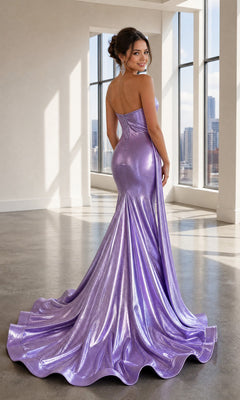 A woman wearing the Long Prom Dress: Atria 6927HF, a shiny lavender strapless gown, stands in a bright room with large windows, looking over her shoulder and smiling.