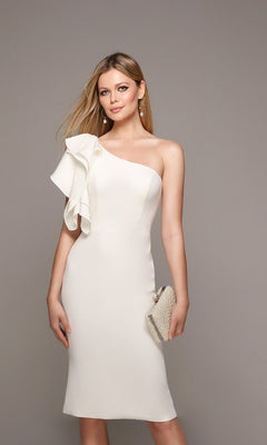 A woman models the Alyce 70005 Knee Length Semi-Formal Dress, a fitted one-shoulder style with ruffle detail, holding a textured clutch against a neutral background.