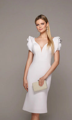 A woman in the Alyce 70024 knee-length white party dress with 3D floral sleeves holds a beaded clutch, standing against a plain background.