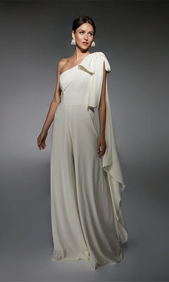 Woman in an ivory Alyce 70065 long formal jumpsuit with one shoulder, wide legs, and draped detail stands against a neutral gray background—a chic alternative to a cocktail dress.