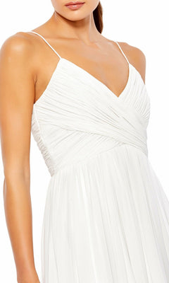 A woman wears the Mac Duggal 70099 A-Line Midi Wedding Guest Dress featuring a white, sleeveless design with thin straps and a pleated, wrap-style bodice.