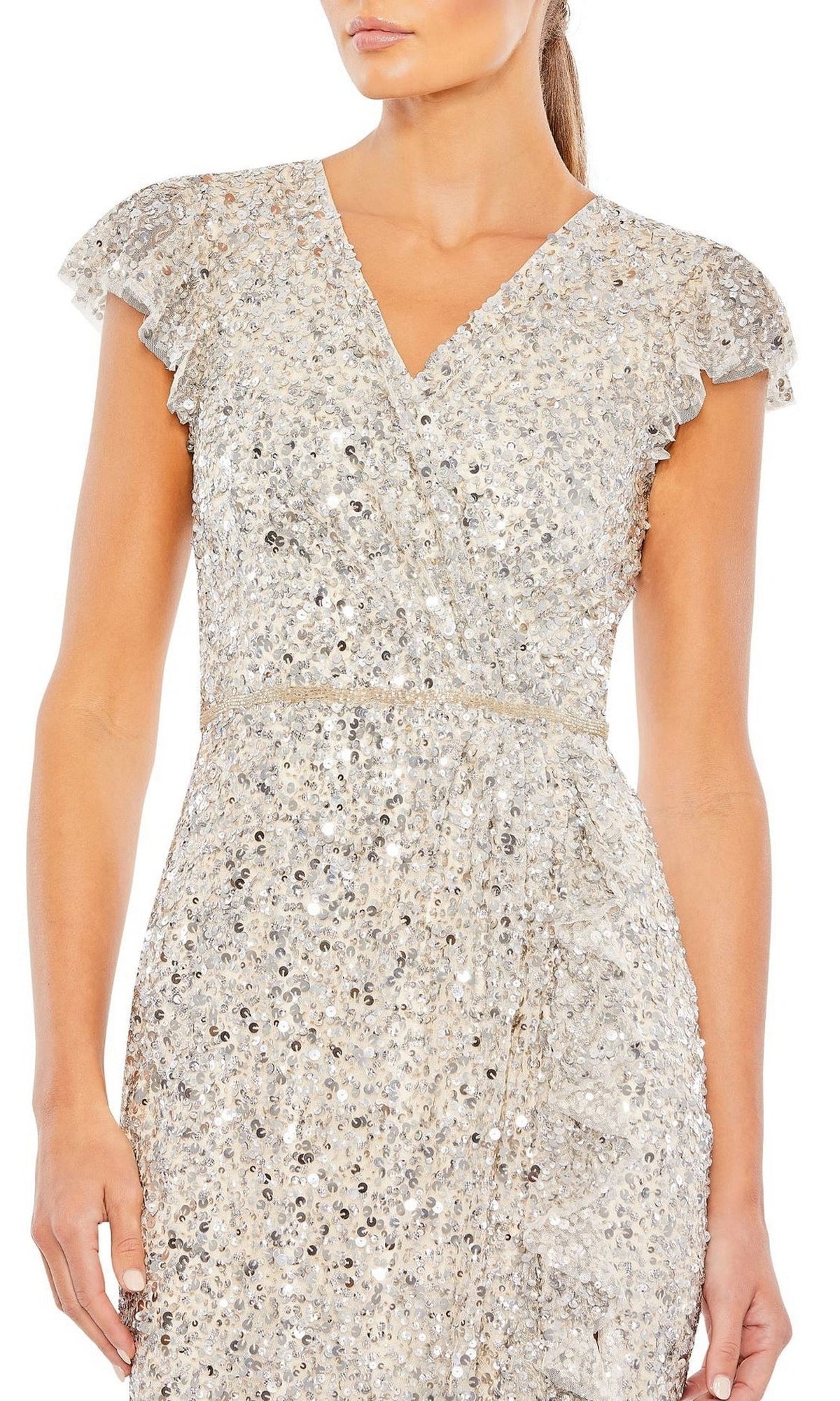 A woman wears the Long Formal Dress 70113 by Mac Duggal, a silver sequin formal gown with short sleeves, a v-neckline, fitted waist, and ruffled details.