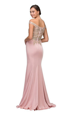Woman in the Long Formal Dress: Eureka 7012 (Bur/Gd) with a fitted bodice and metallic lace applique, posing with a slight smile over her shoulder.