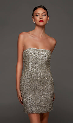 A woman wearing the Short White Party Dress: Alyce 70124—with a strapless, beaded design and fitted silhouette—poses against a plain gray background, accessorized with earrings and red lipstick.
