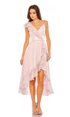 A woman wearing the Mac Duggal 70163 short green wedding guest dress.