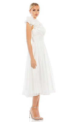 A woman stands sideways in high-heeled sandals, wearing the Short Wedding Guest Dress 70165 by Mac Duggal—a sleeveless, white, knee-length party dress with a ruched ruffled bodice and high collar—against a white background.