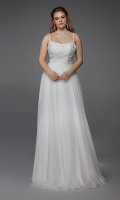 A woman models the Alyce 7018 long dress in diamond white, featuring a chiffon A-line skirt, lace bodice detailing, and thin straps, standing against a plain gray background.