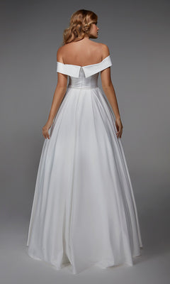 A woman faces away, wearing the Long White Dress: Alyce 7023—an off-the-shoulder evening gown with a fitted bodice and full skirt—set against a plain gray background.