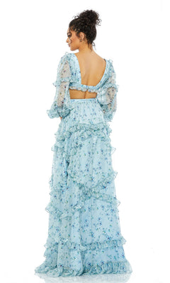 A woman faces away, wearing the Mac Duggal 70249 long sleeve blue formal dress featuring a floral print, ruffles, puffed sleeves, and an open back finished with a bow.