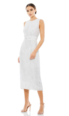A woman models the Beaded Midi Wedding Guest Dress: Mac Duggal 70264—sleeveless, knee-length, fitted waist—paired with nude heels against a plain white background.