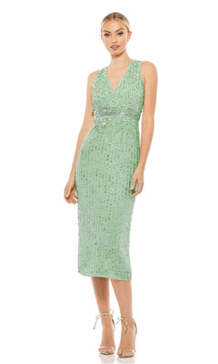 A woman wears the Mac Duggal 70267 Beaded Midi Wedding-Guest Dress with nude heels, posing against a white background.
