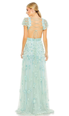 A woman stands facing away in the Long Formal Dress 70275 by Mac Duggal, a light blue A-line gown featuring floral embellishments, sheer short sleeves, and a lace-up open back.
