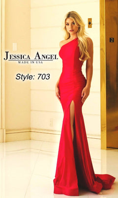 Woman in the Jessica Angel 703 One-Shoulder Long Prom Dress with a mermaid silhouette and thigh-high slit, posing indoors by an elevator. Text: "Made in USA.