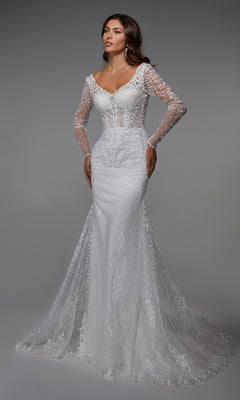 A woman in the Alyce 7030 long formal dress—an ivory, embroidered, long-sleeved lace sheath gown with a flowing train—stands against a plain gray background.