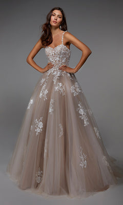 A woman wearing the Alyce 7043 long formal dress in Ivory/Latte, featuring a sleeveless lace bodice and a full tulle ballgown skirt, stands against a plain gray background.