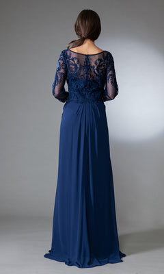 A woman models the Modest Long-Sleeve Mother-of-the-Bride Dress 7043—an elegant floor-length navy chiffon gown with sheer embroidered sleeves and back—standing with her back to the camera against a plain background.