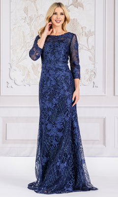 A woman stands indoors wearing the Floral-Embroidered Long Sleeve Formal Dress 7045, a floor-length navy gown with elegant floral embroidery.