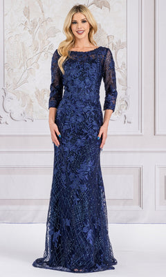 A woman stands before an ornate wall, wearing the Floral-Embroidered Long Sleeve Formal Dress 7045—a navy blue lace gown with three-quarter sleeves and delicate floral embroidery.