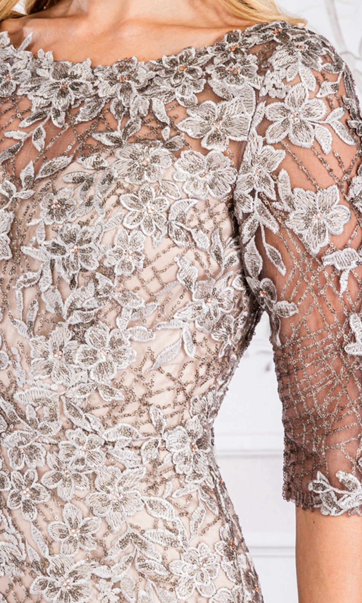 Close-up of the Floral-Embroidered Long Sleeve Formal Dress 7045, showcasing its intricate silver floral embroidery and sheer sleeves.
