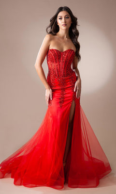 A woman stands against a neutral background, wearing the Strapless Long Beaded Sheer-Bodice Prom Dress 7051 featuring a corset-style bodice, beaded accents, a sheer tulle skirt, and a thigh-high slit.