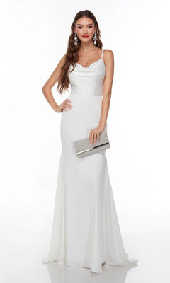 A woman in the Alyce 7051 long white dress with spaghetti straps, holding a silver clutch and wearing dangling earrings, stands against a plain white background.