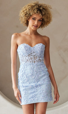 A woman with curly blonde hair models the Embroidered-Lace Strapless Short Hoco Dress 7053S in light blue, standing against a light neutral background.