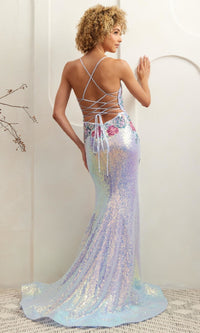 Woman modeling the back of a light blue sequin evening gown with a strappy backless design, standing against a white wall.
