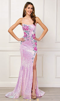 Woman wearing a pink sequin evening gown with a slit and floral designs on a white background