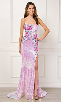 Woman wearing a light pink sequin dress with a slit on a white background