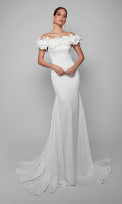 A woman models the Alyce 7061 long formal dress, featuring an off-the-shoulder neckline with floral detailing and a sweeping train, posed against a plain background.