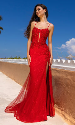 A woman stands outdoors under a sunny blue sky, wearing the Long Mermaid Prom Dress: Amelia Couture 7064—a red, sleeveless, floral lace gown with bead embellishments.