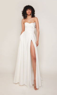 A woman models the Alyce 7088 Long Formal Dress, featuring a strapless sweetheart neckline and high thigh slit, set against a plain light background.