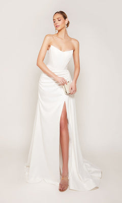 A woman models the Alyce 7093 long formal dress in diamond white—a strapless satin gown with a thigh-high slit—holding a clutch and posing against a plain background.