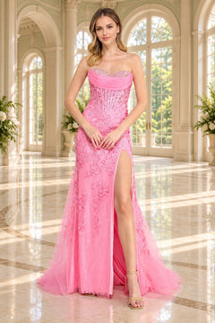 Amelia Couture 7096 pink strapless sweetheart corset prom dress with a floor-length silhouette, floral appliqués, and a high side slit.