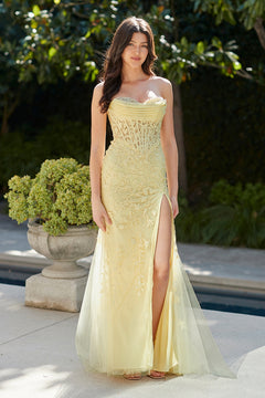Amelia Couture 7096 long prom dress: a pale yellow, strapless sweetheart gown with a corset bodice, floral embroidery, and a high leg slit.