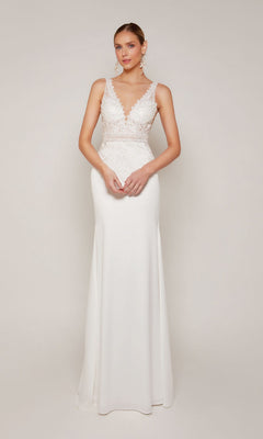 A woman stands against a plain light background wearing the Alyce 7097 long formal dress in diamond white, featuring an illusion lace bodice and a flowing skirt.