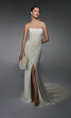 A woman wearing the Long White Dress: Alyce 7102, a strapless white bridal gown with a thigh-high slit and corset bodice, holds a bouquet of white flowers against a plain gray background.