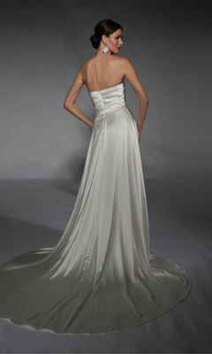 A woman in the Alyce 7107 long white strapless satin A-line dress with a train stands facing away against a plain gray backdrop.