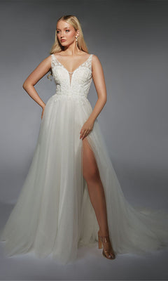 A woman models the Alyce 7125 long ivory dress, featuring a sleeveless design, plunging neckline, lace bodice, and high-slit tulle skirt against a gray background—an elegant choice for any formal evening occasion.