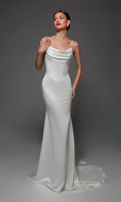 A woman models the Long Wedding Dress: Alyce 7175, a white fitted satin gown featuring a corset bodice, spaghetti straps, cowl neckline, and a floor-length skirt with a small train.