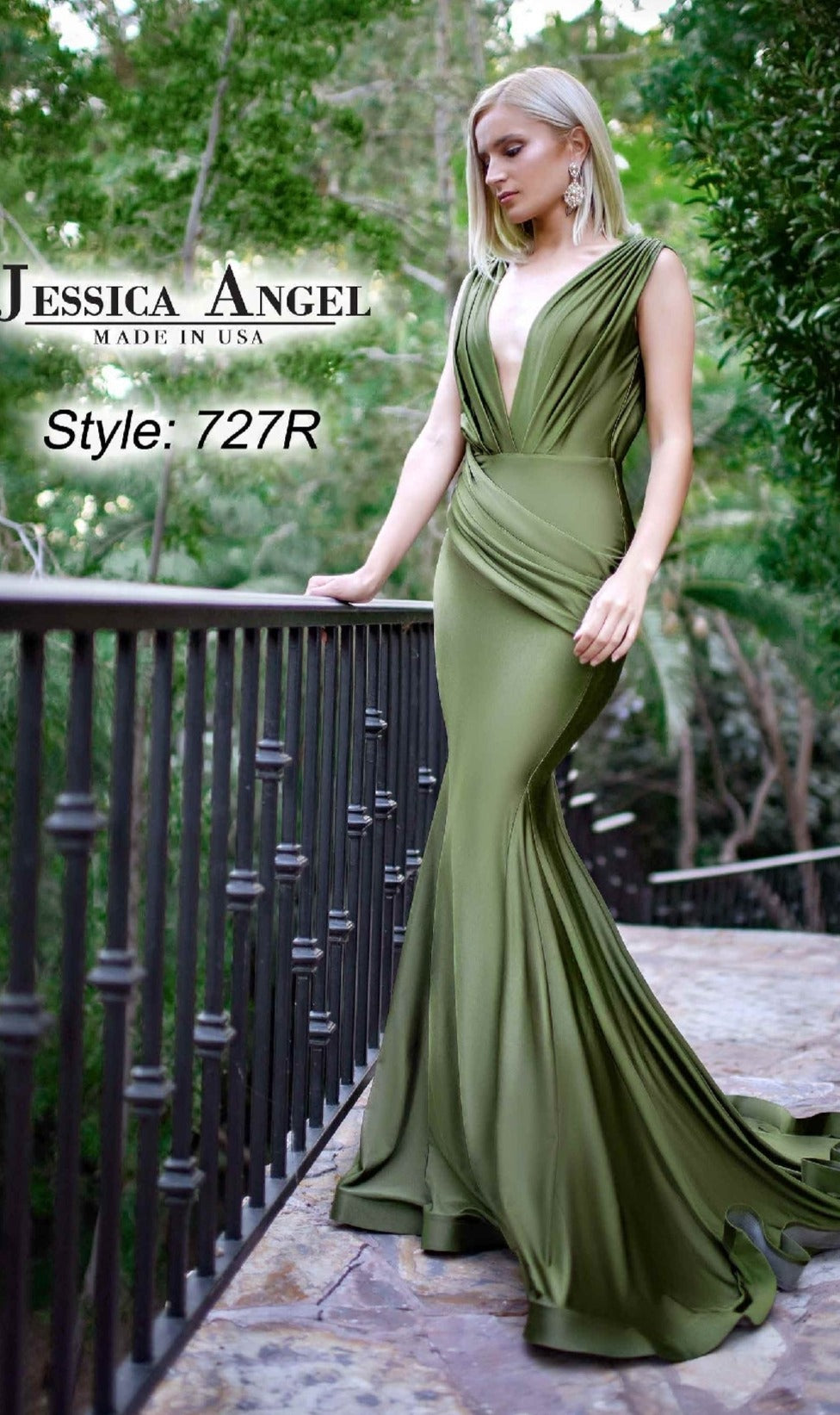 Woman wearing a fitted, olive green Sleeveless Long Prom Dress: Jessica Angel 727R with a deep V-neck and draped details, standing outdoors amid greenery. Ideal for prom or any formal event.