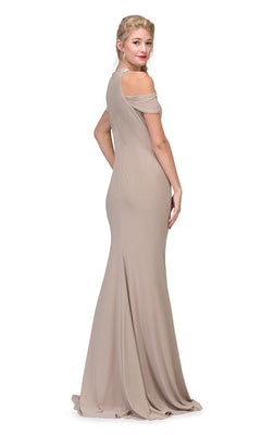 A woman poses facing away from the camera, glancing back over her shoulder in the Eureka 7400 long formal dress with a cold shoulder neckline and floor-length taupe design, set against a white background.
