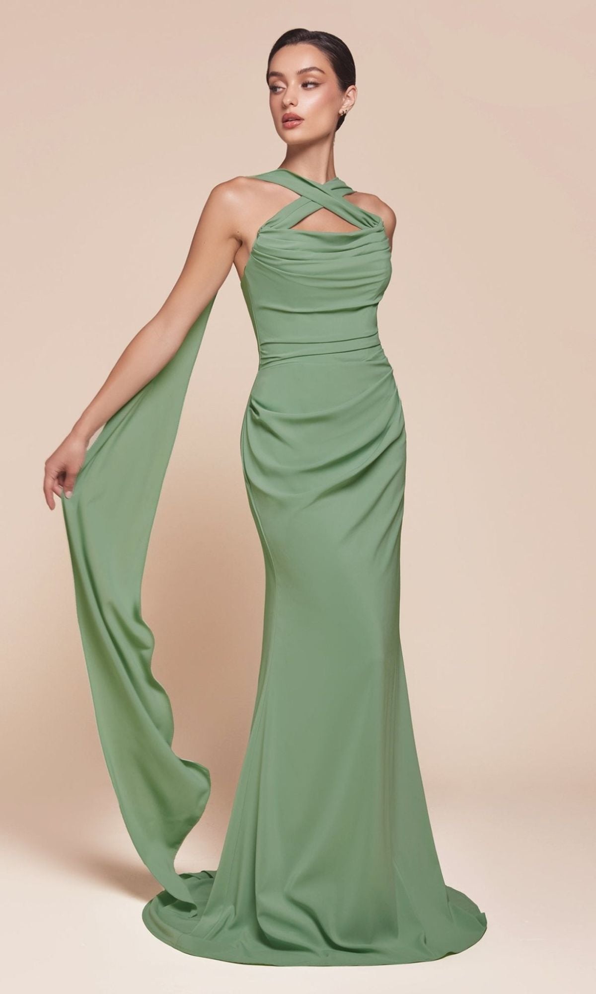 A woman poses in the Ladivine 7433 Multi-Way Long Chiffon Prom Dress, featuring a crisscross halter neckline and draped detail over one arm, set against a neutral background.