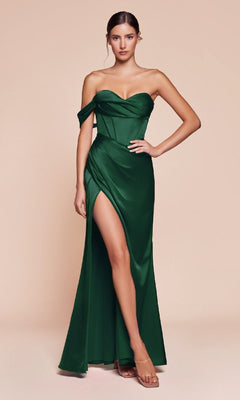 A woman poses against a beige background in the One-Strap Long Satin Prom Dress: Ladivine 7448, a green gown featuring a thigh-high slit, paired with strappy heels.