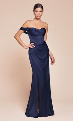 A woman stands against a plain beige background in the Ladivine 7448, a navy blue, one-shoulder lace-up prom dress with a fitted corset bodice and front slit.