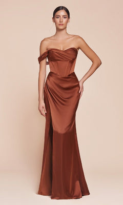 A woman wears the Ladivine 7448 One-Shoulder Lace-Up Prom Dress, a fitted copper satin gown with a corset bodice and draped skirt, set against a plain beige background.