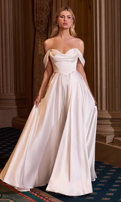 A woman stands indoors in the Ladivine 7449W Off-Shoulder Long White Prom Dress, radiating elegance between tall columns and ornate curtains—a perfect look for any special occasion.