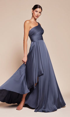 A woman models the One-Shoulder Long A-Line Prom Dress: Ladivine 7450 in slate blue, featuring a flowy asymmetrical hem, standing against a beige background.
